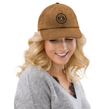 woman in camel hat